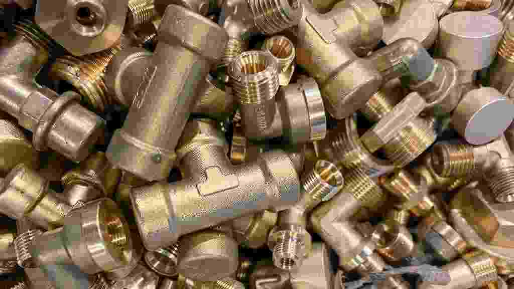 Yellow,Brass,Scrap,Nuts,And,Bolts,Ready,To,Be,Recycled